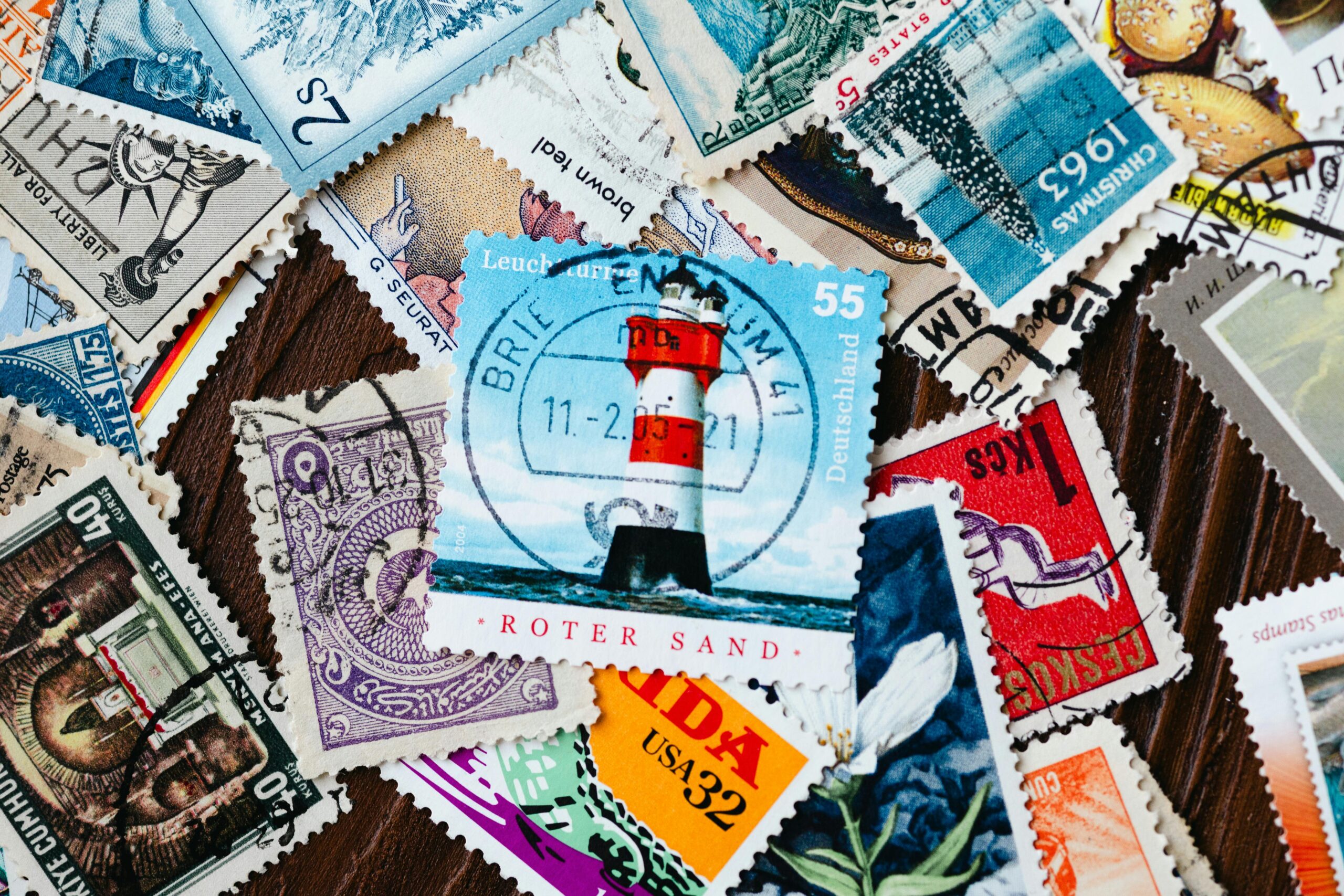 A vibrant assortment of international vintage postage stamps, highlighting various designs and histories.